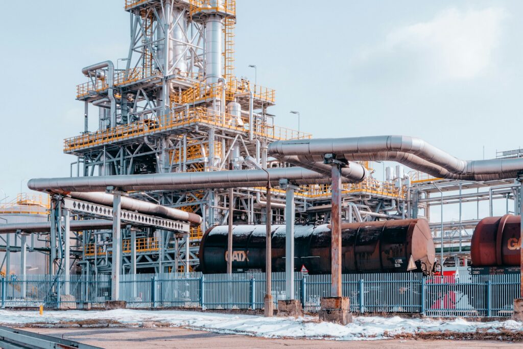 The Petroleum Industry: How Refined Petrol Reaches Your Vehicle 2 a large industrial plant with pipes and pipes